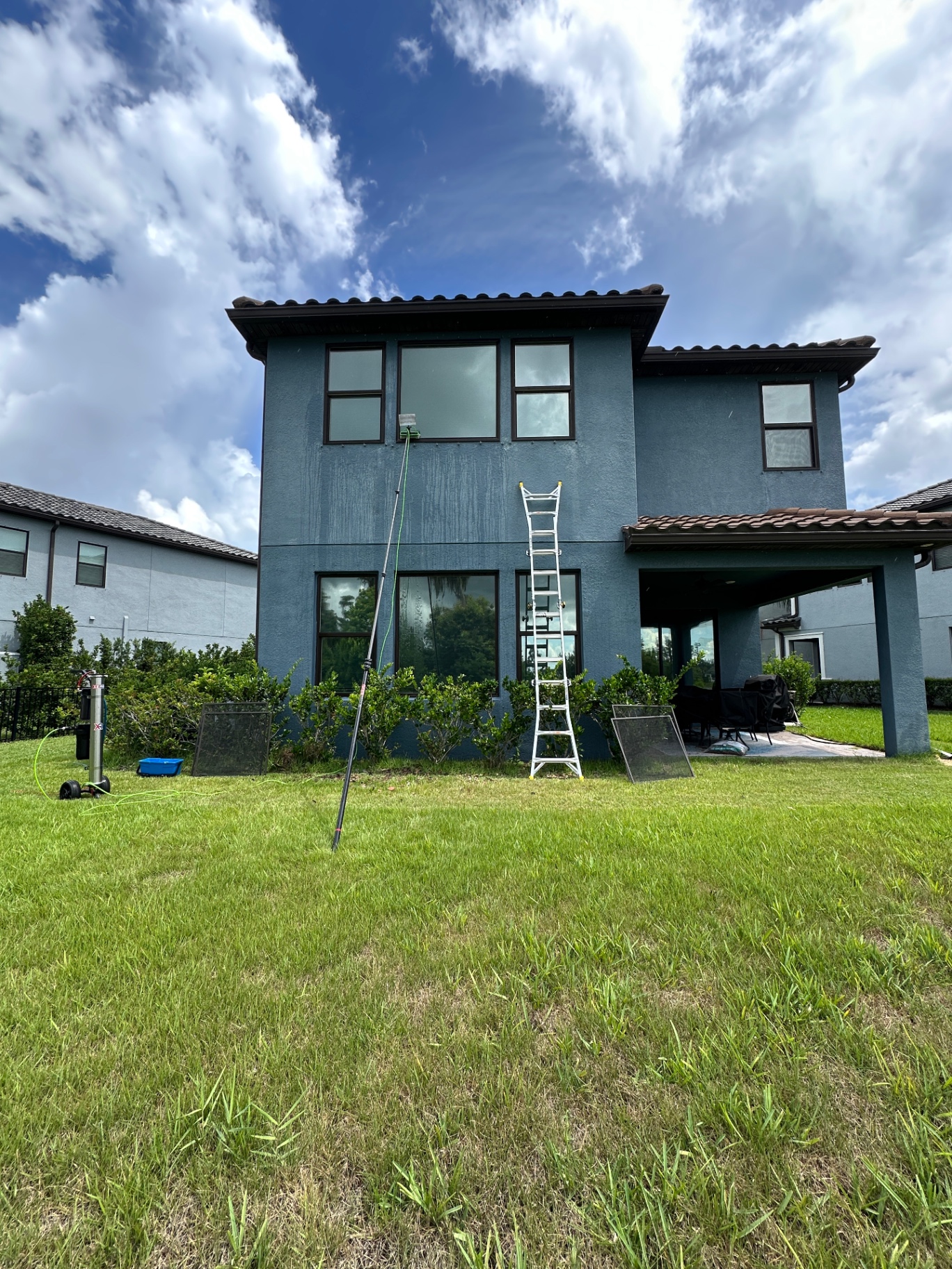 Rear elevation — water-fed pole reaching second-story windows