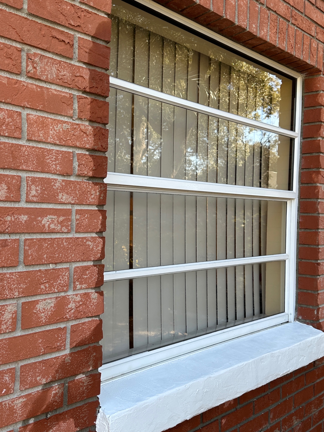 Red brick home window — spotless finish