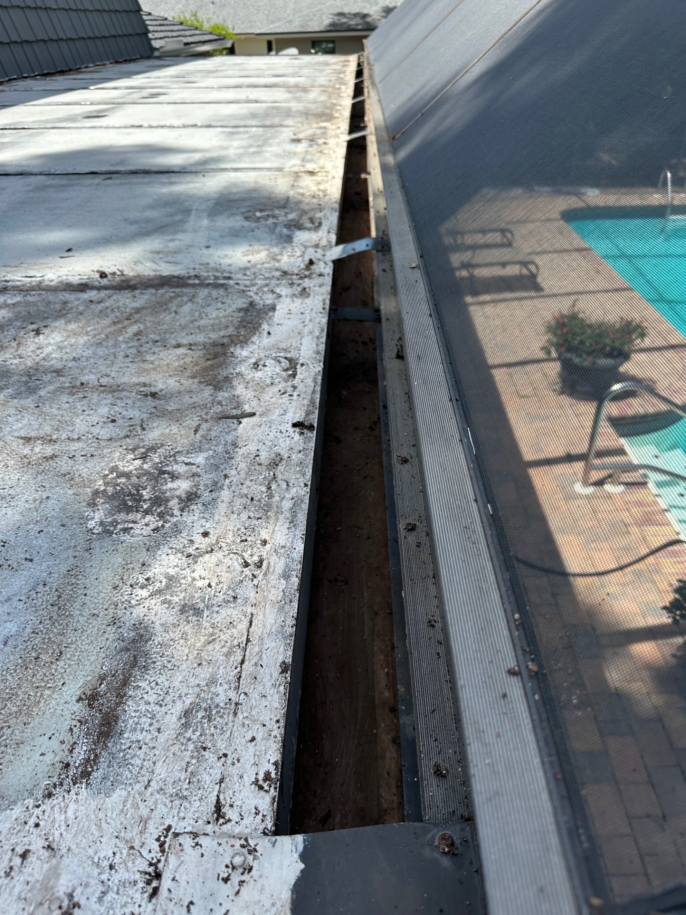 Gutter fully cleared — poolside detail