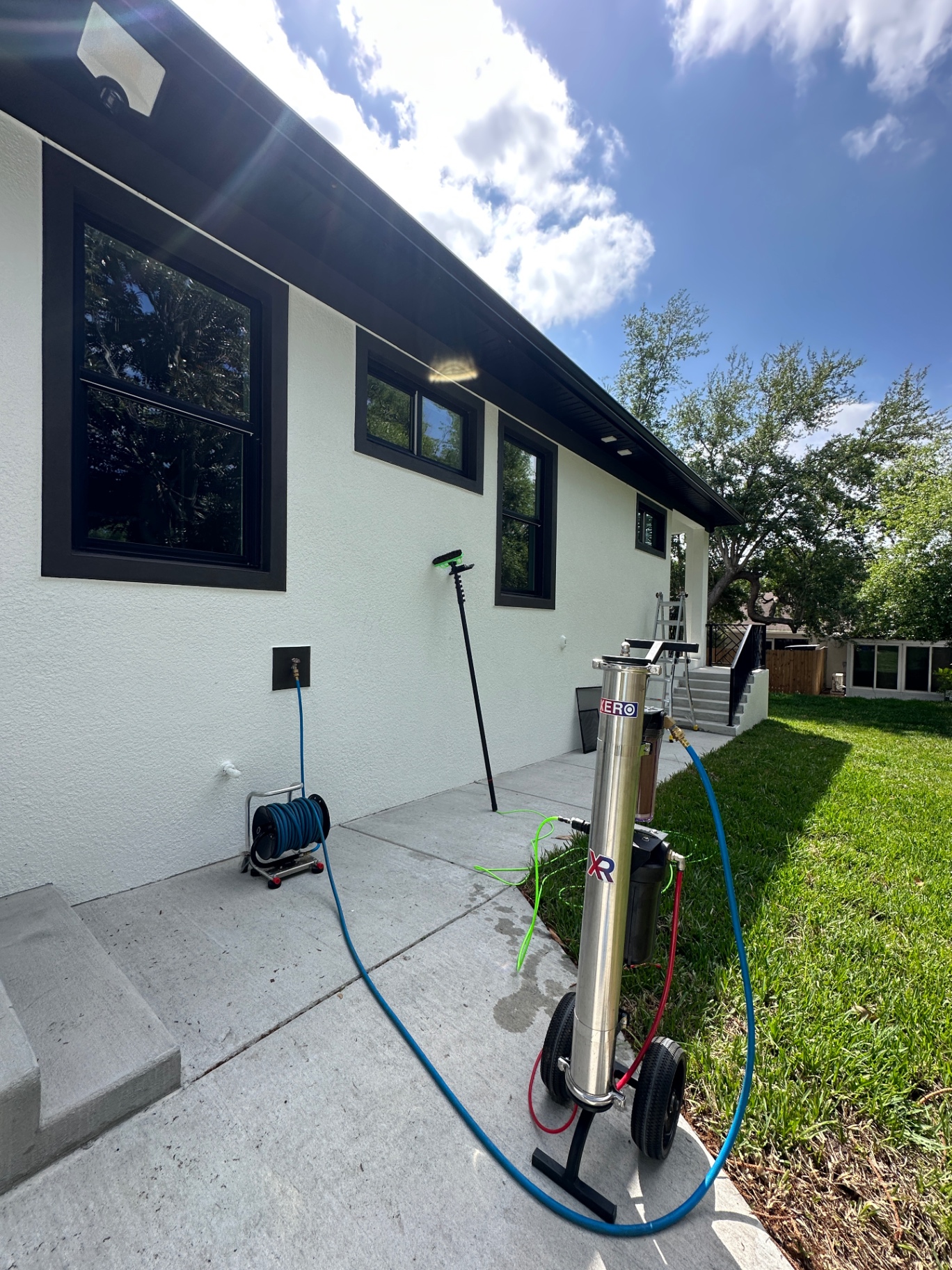 XERO water-fed pole setup — pure water rinse in action