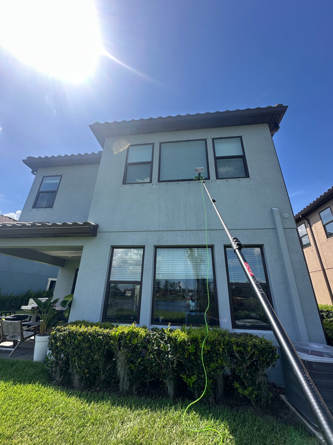 Water-fed pole cleaning — second-story windows